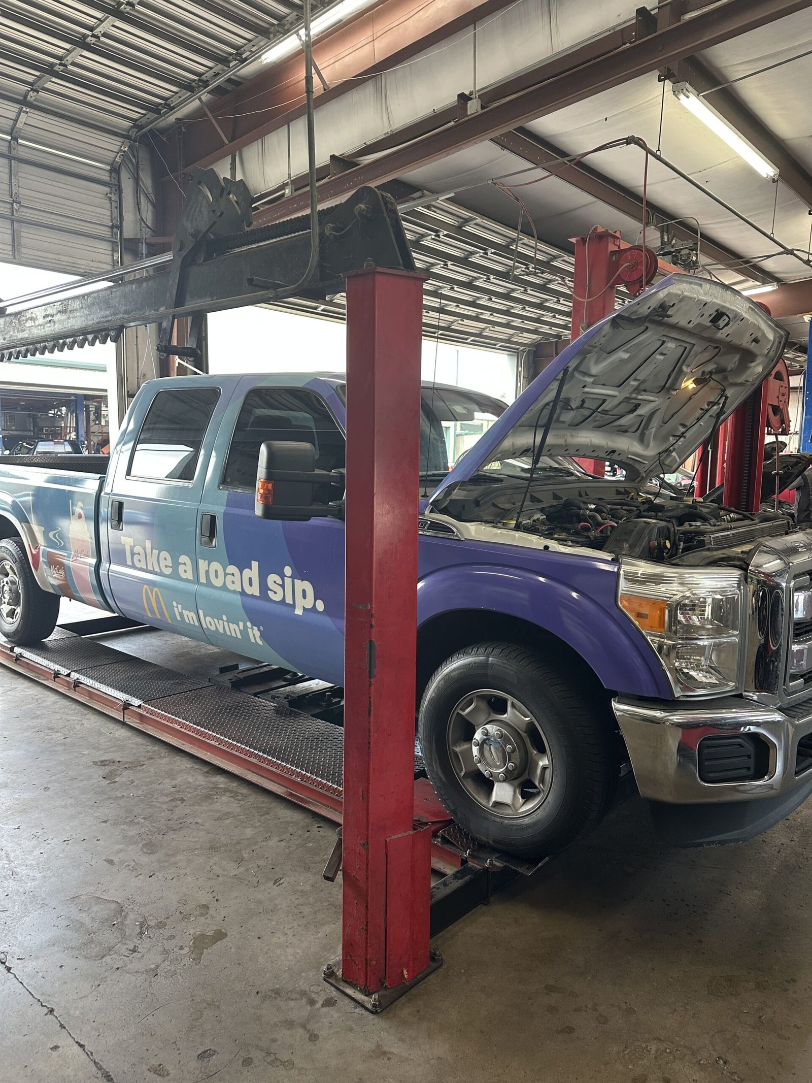 Friendly staff assisting customers at Woodlands Car Care & Collision Center reception