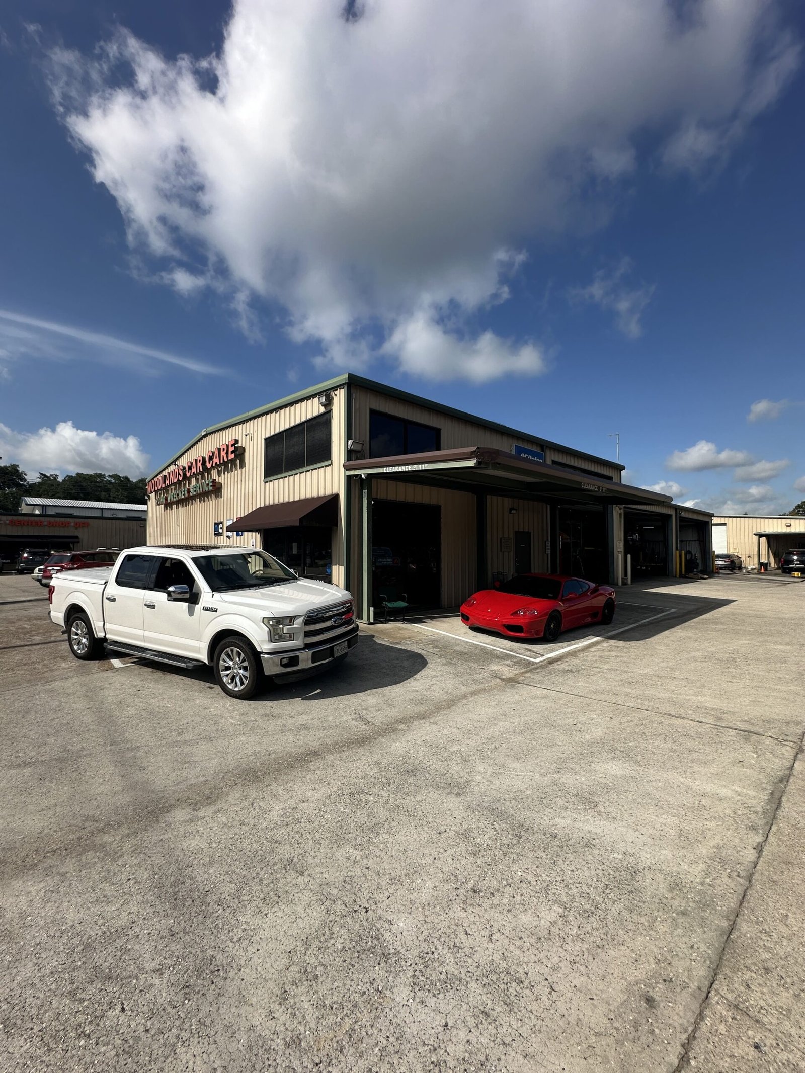 Staff assisting customers at Woodlands Car Care & Collision Center