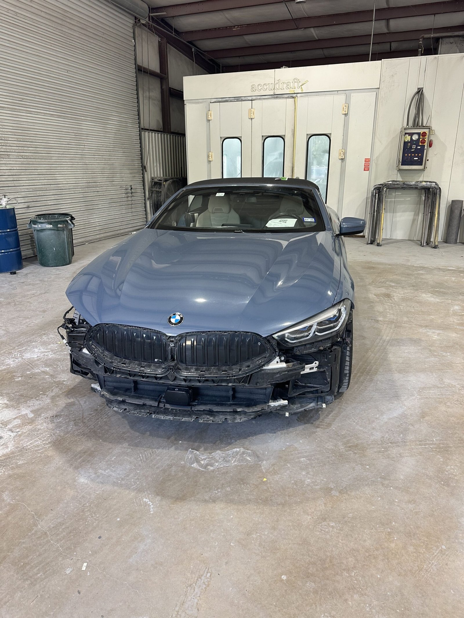 Vehicle wheel alignment being performed at Woodlands Car Care & Collision Center